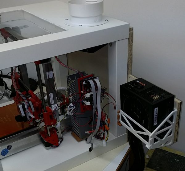 Fan mounted to push fumes down the hose.